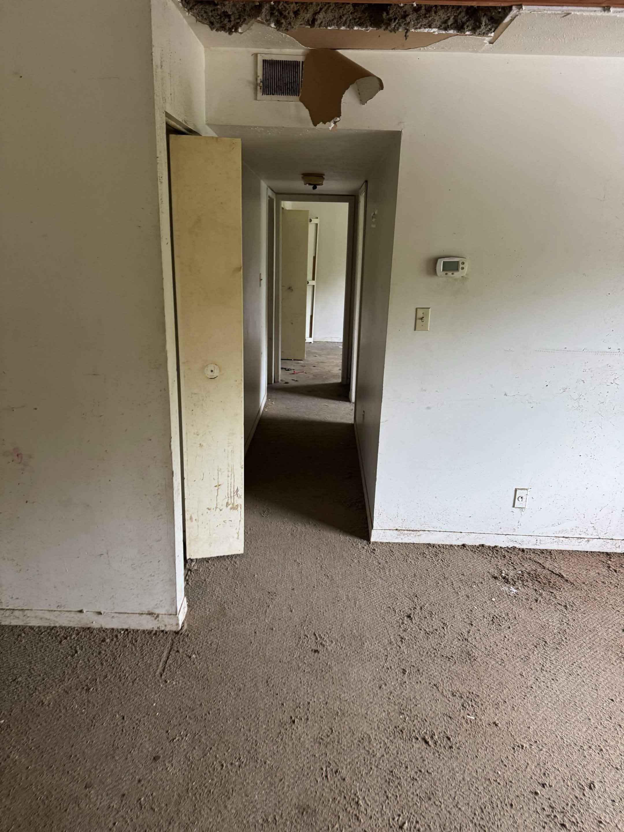 Cleared, emptied hallway after Titan Junk Removal completed a whole-home property cleanout in Paducah, KY